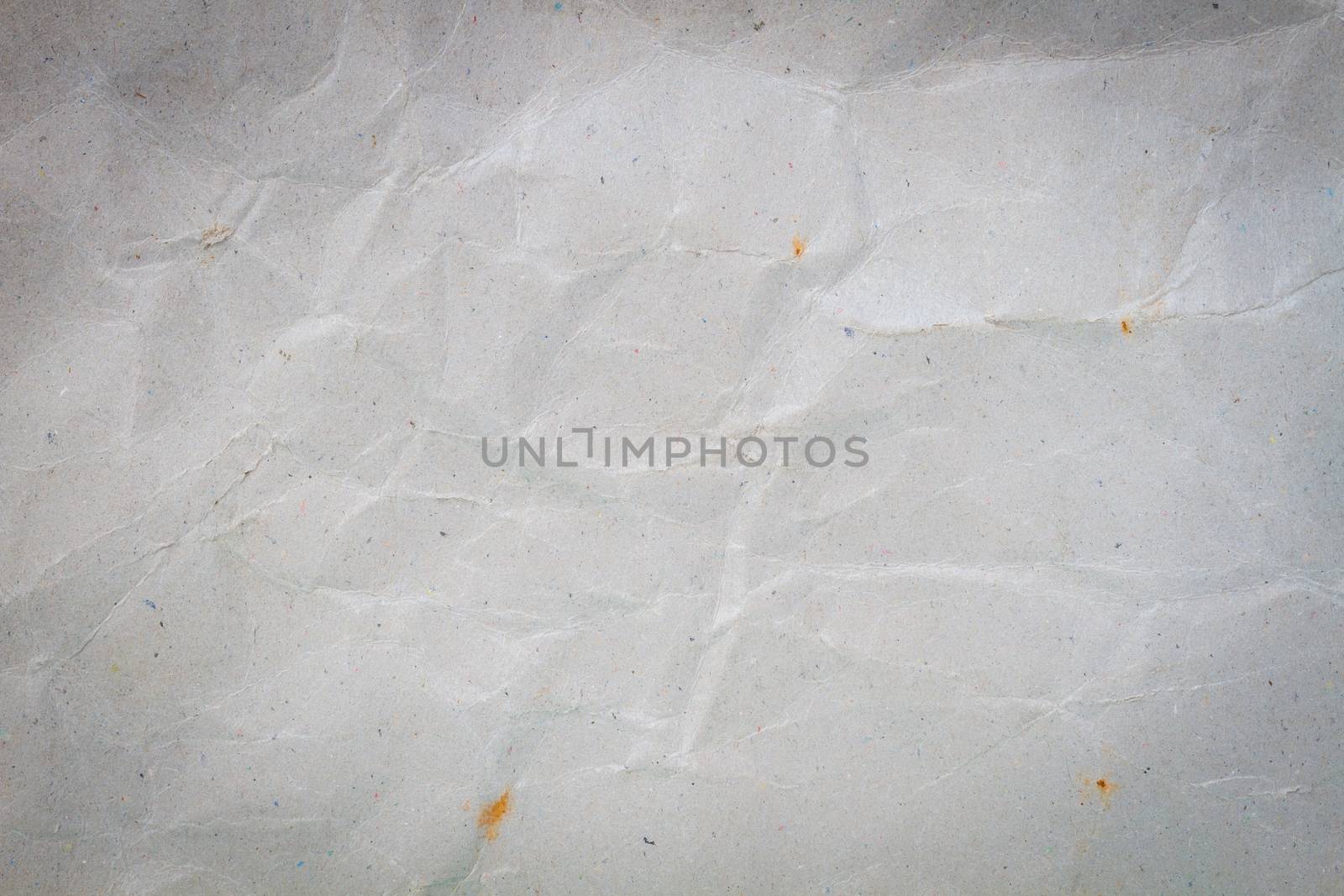 crumpled grey cardboard with background and texture, vignette