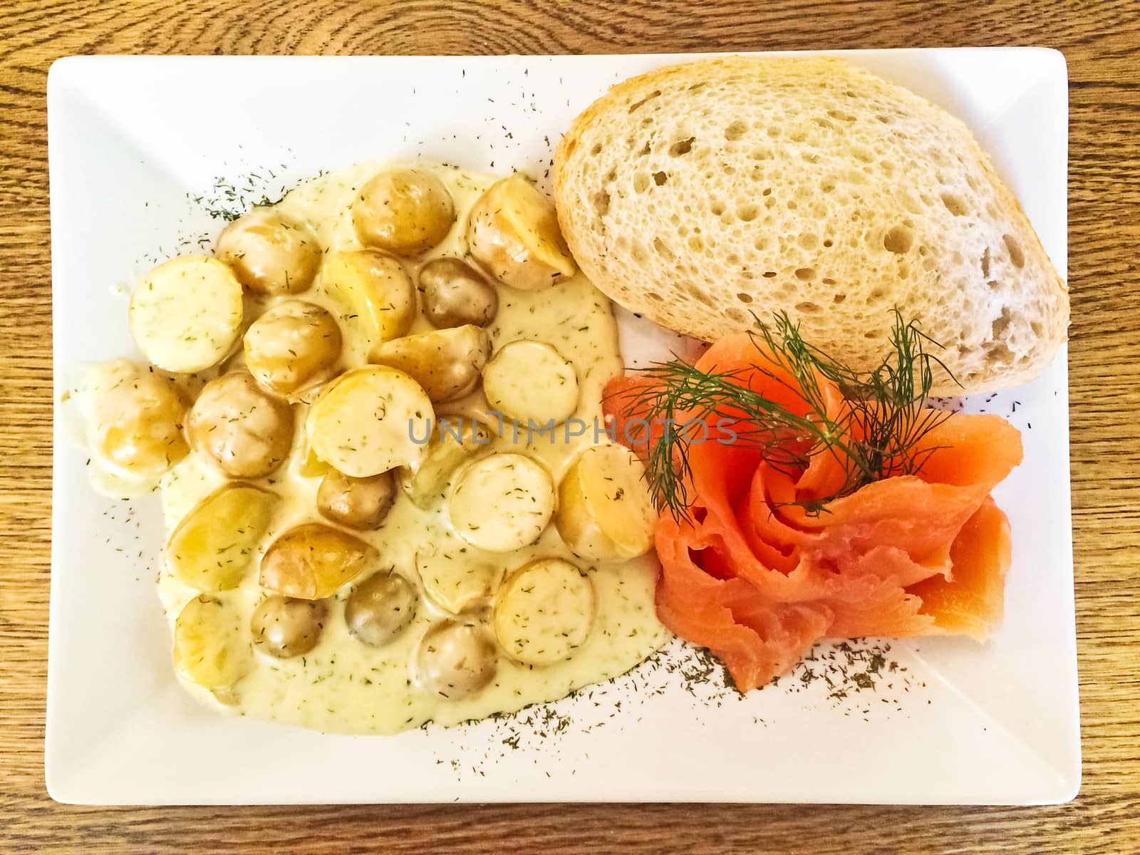 Smoked salmon and potatoes, traditional Swedish cuisine.