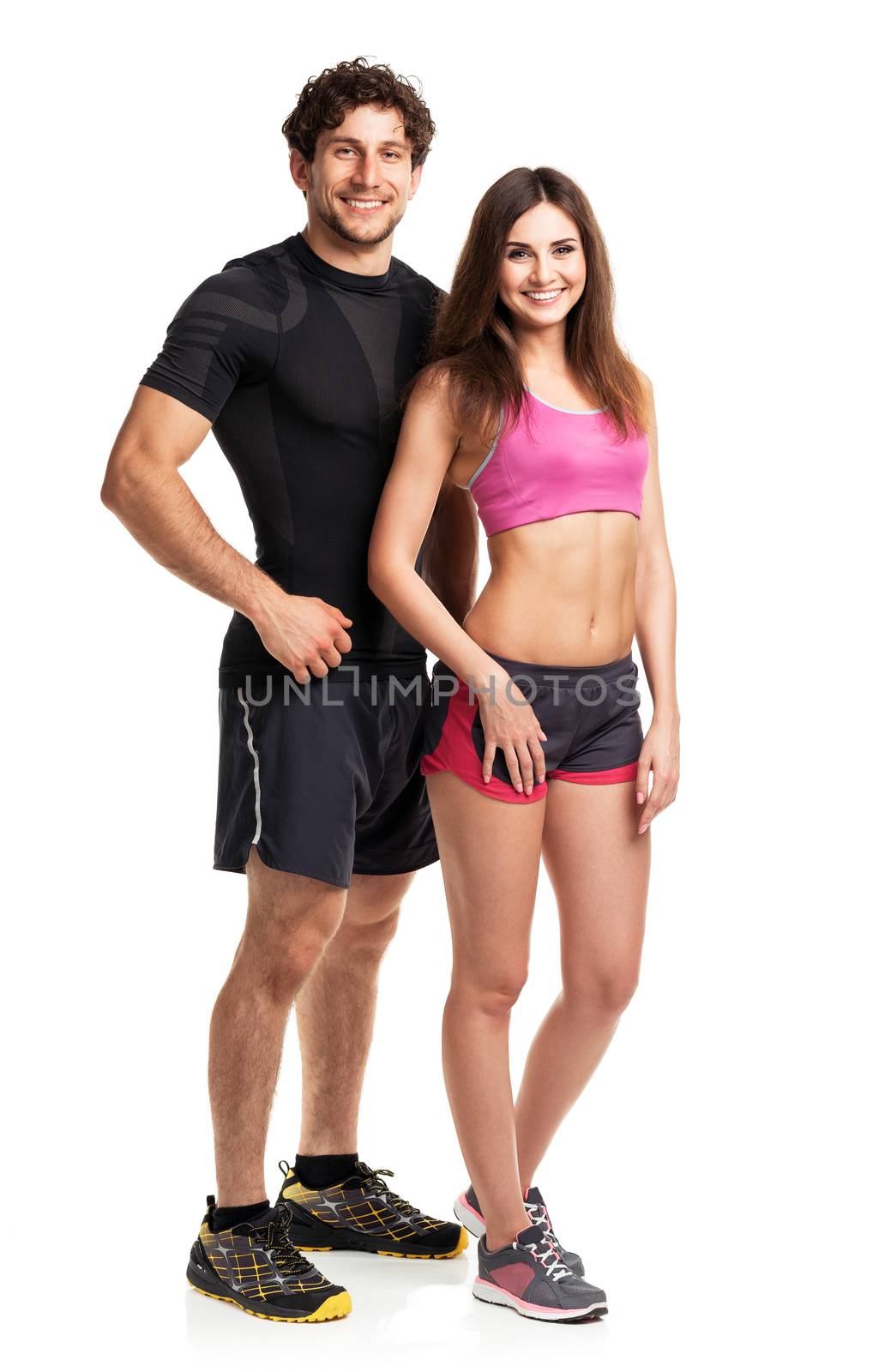 Sport couple - man and woman after fitness exercise on the white background