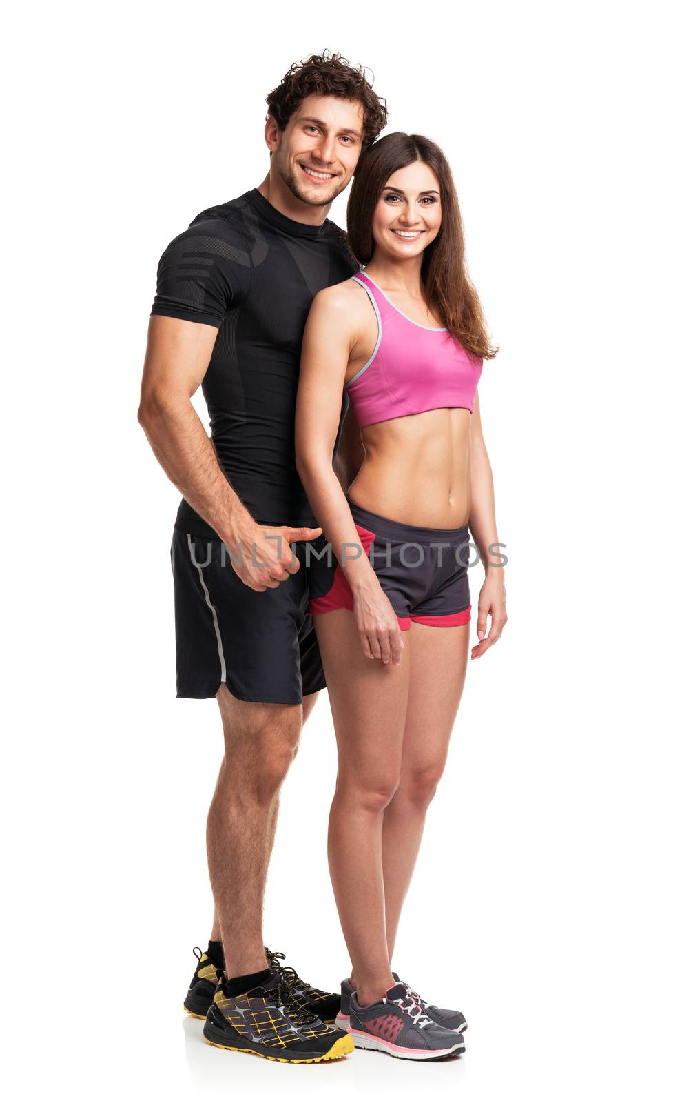 Sport couple - man and woman after fitness exercise on the white background