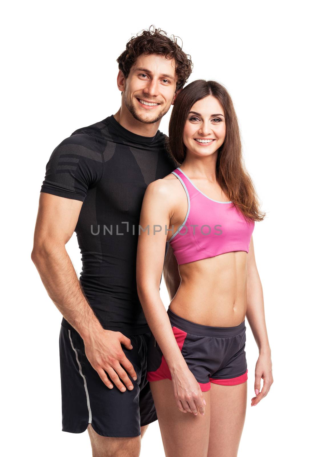 Athletic couple after fitness exercise on the white by vlad_star