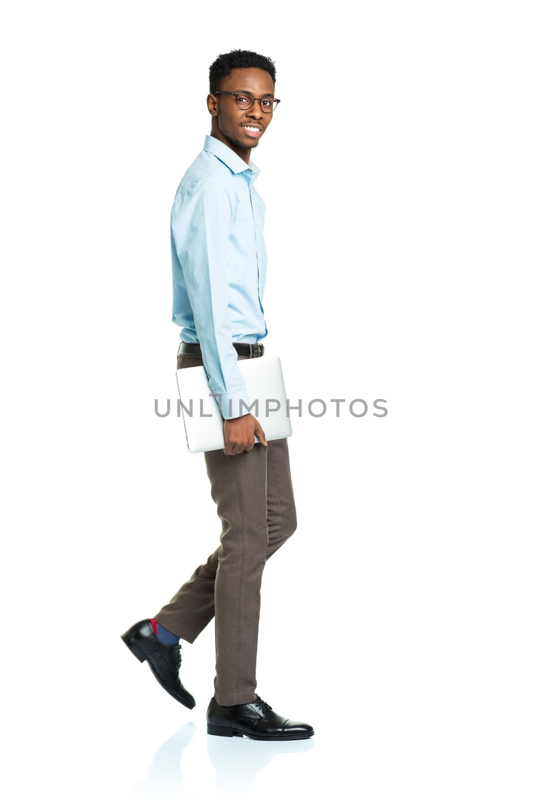 Happy african american college student with laptop standing on white background