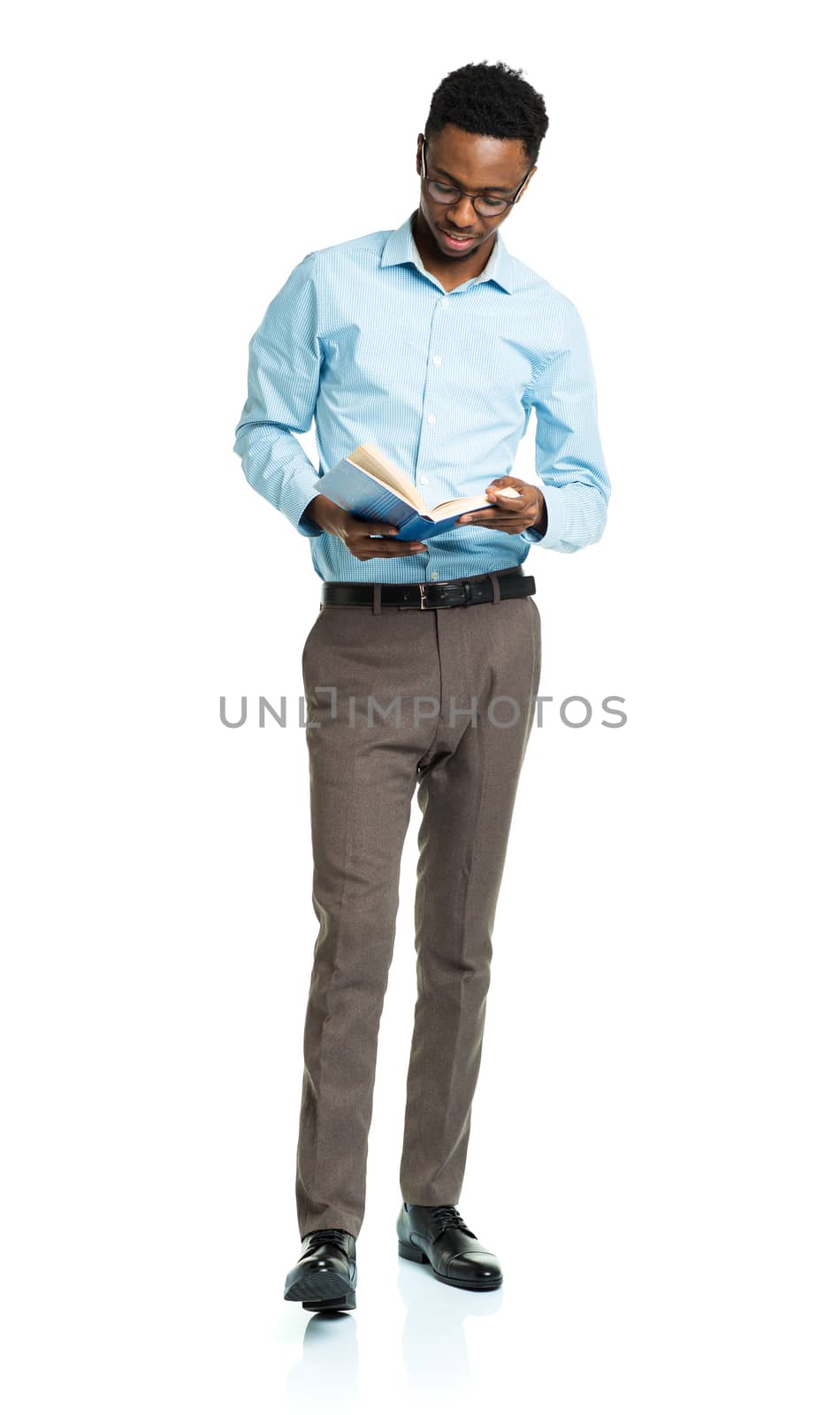 Happy african american college student with books in his hands   by vlad_star