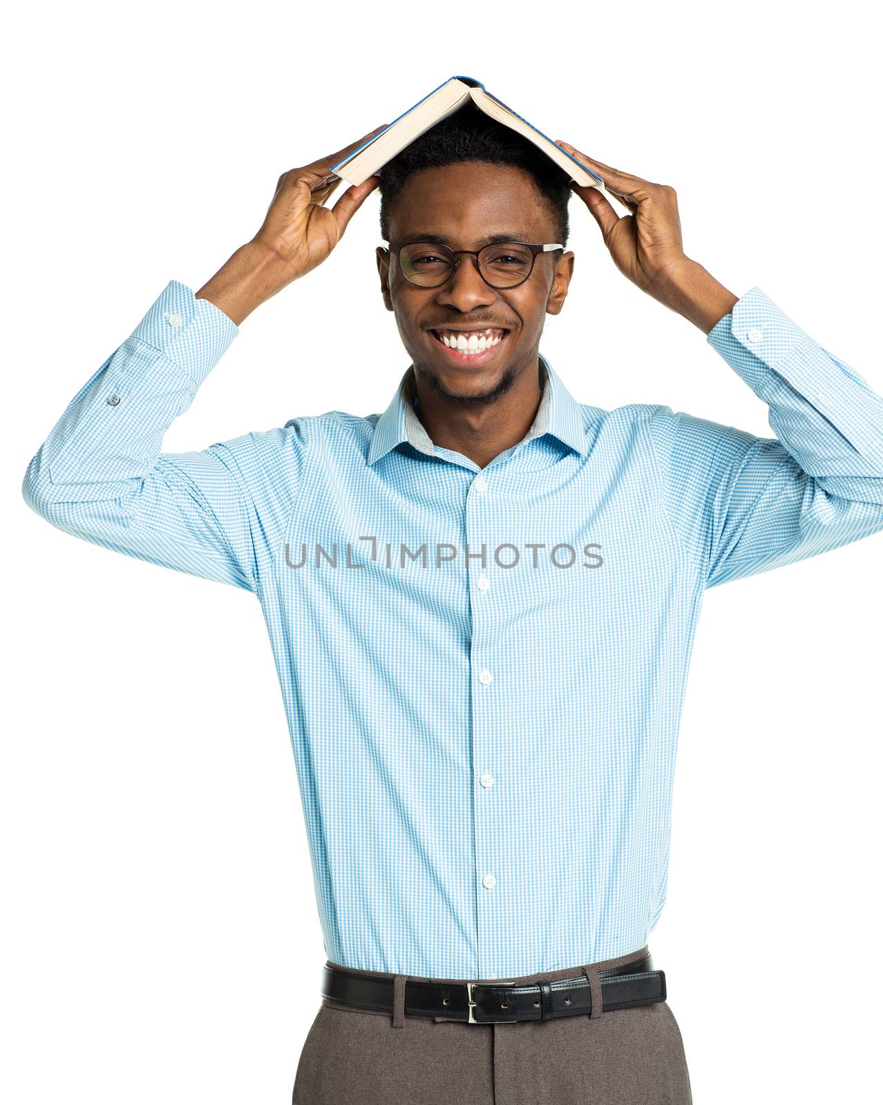 Happy african american college student with book on his head standing on white background