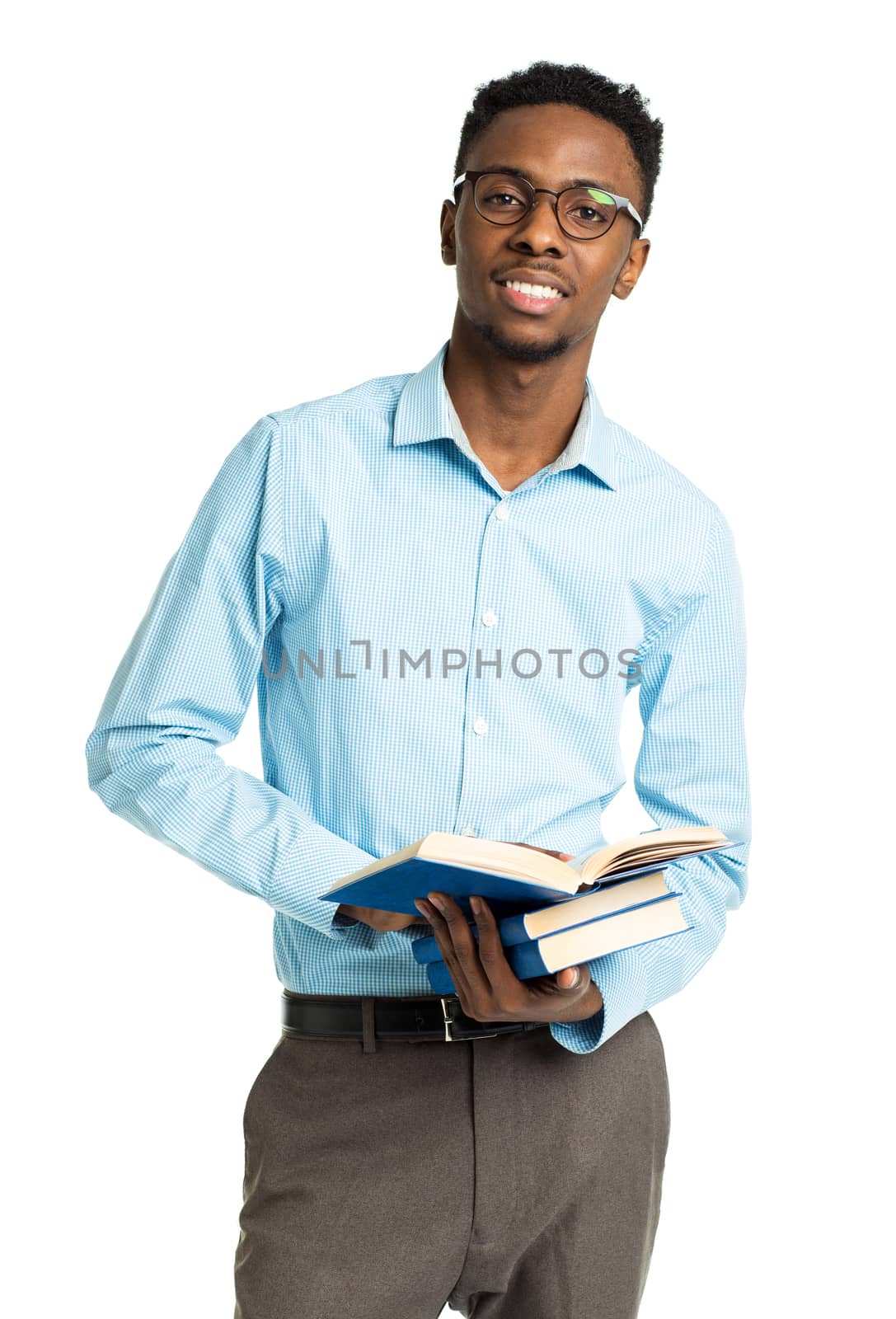 Happy african american college student with books in his hands  standing on white background