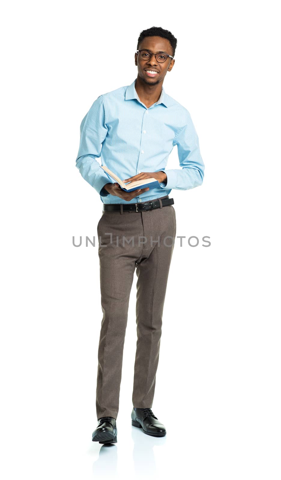 Happy african american college student with books in his hands  standing on white background