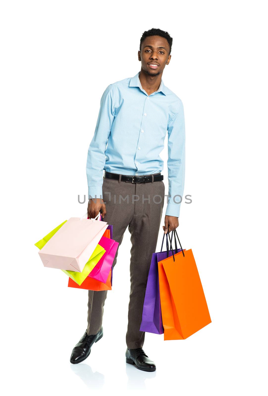 Happy african american man holding shopping bags on white backgr by vlad_star