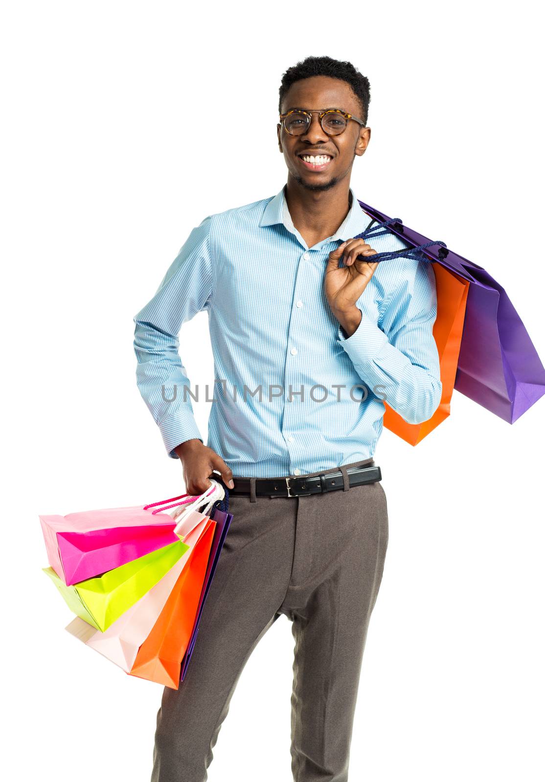 Happy african american man holding shopping bags on white background. Holidays concept