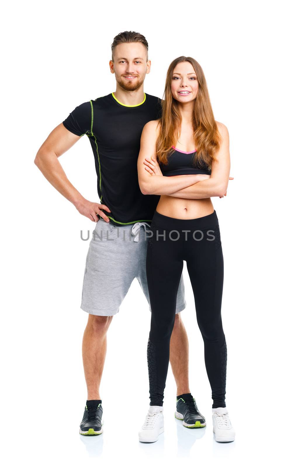 Athletic couple - man and woman after fitness exercise on the wh by vlad_star