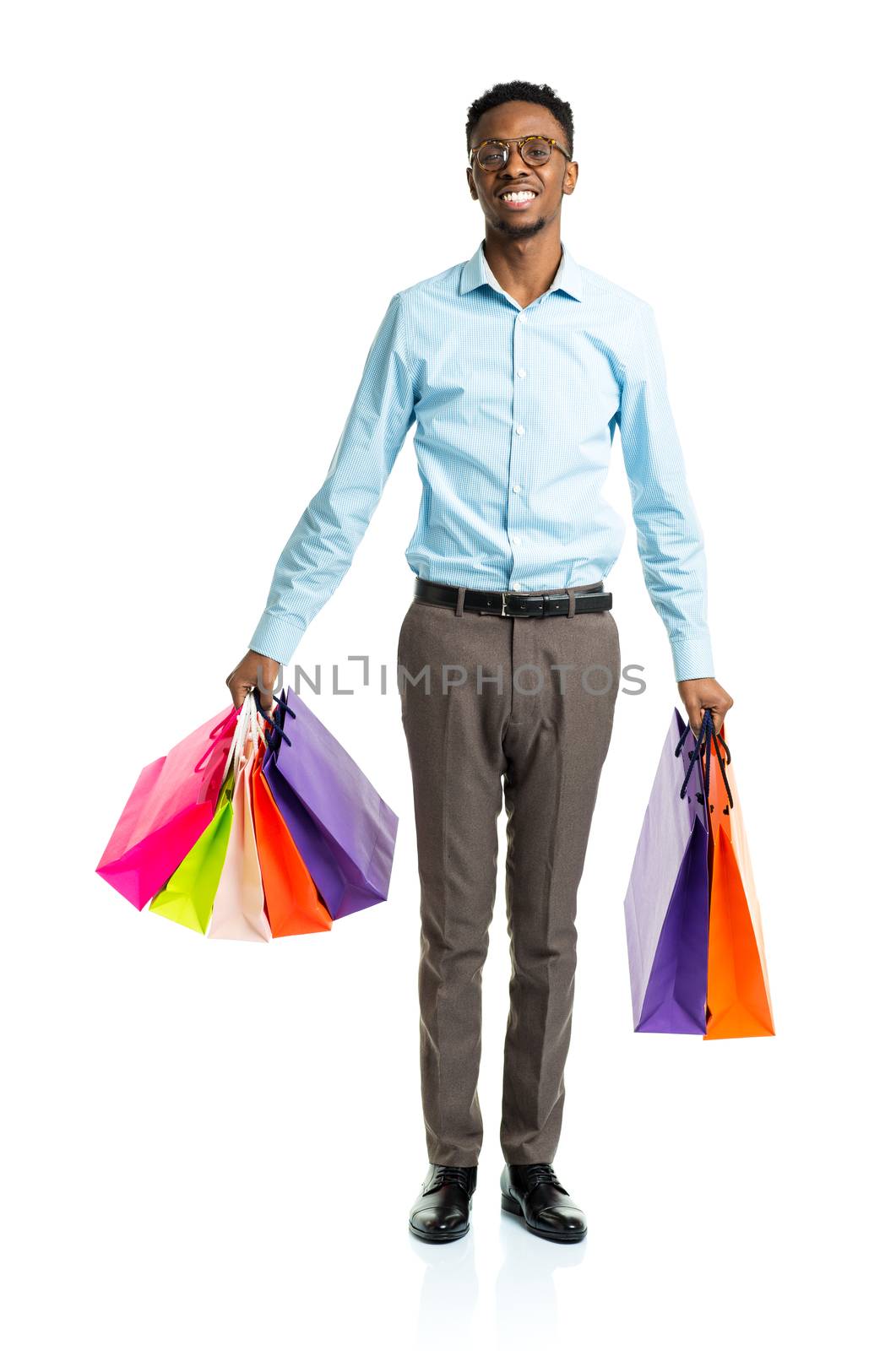 Happy african american man holding shopping bags on white backgr by vlad_star