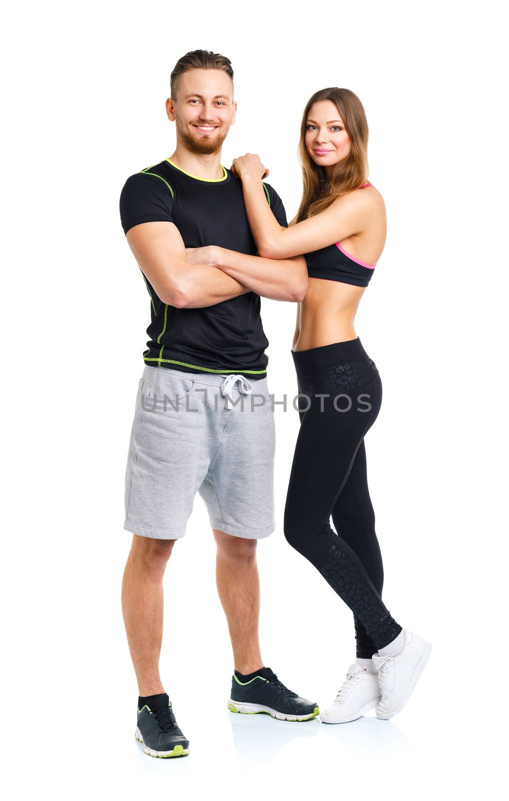 Athletic couple - man and woman after fitness exercise on the wh by vlad_star