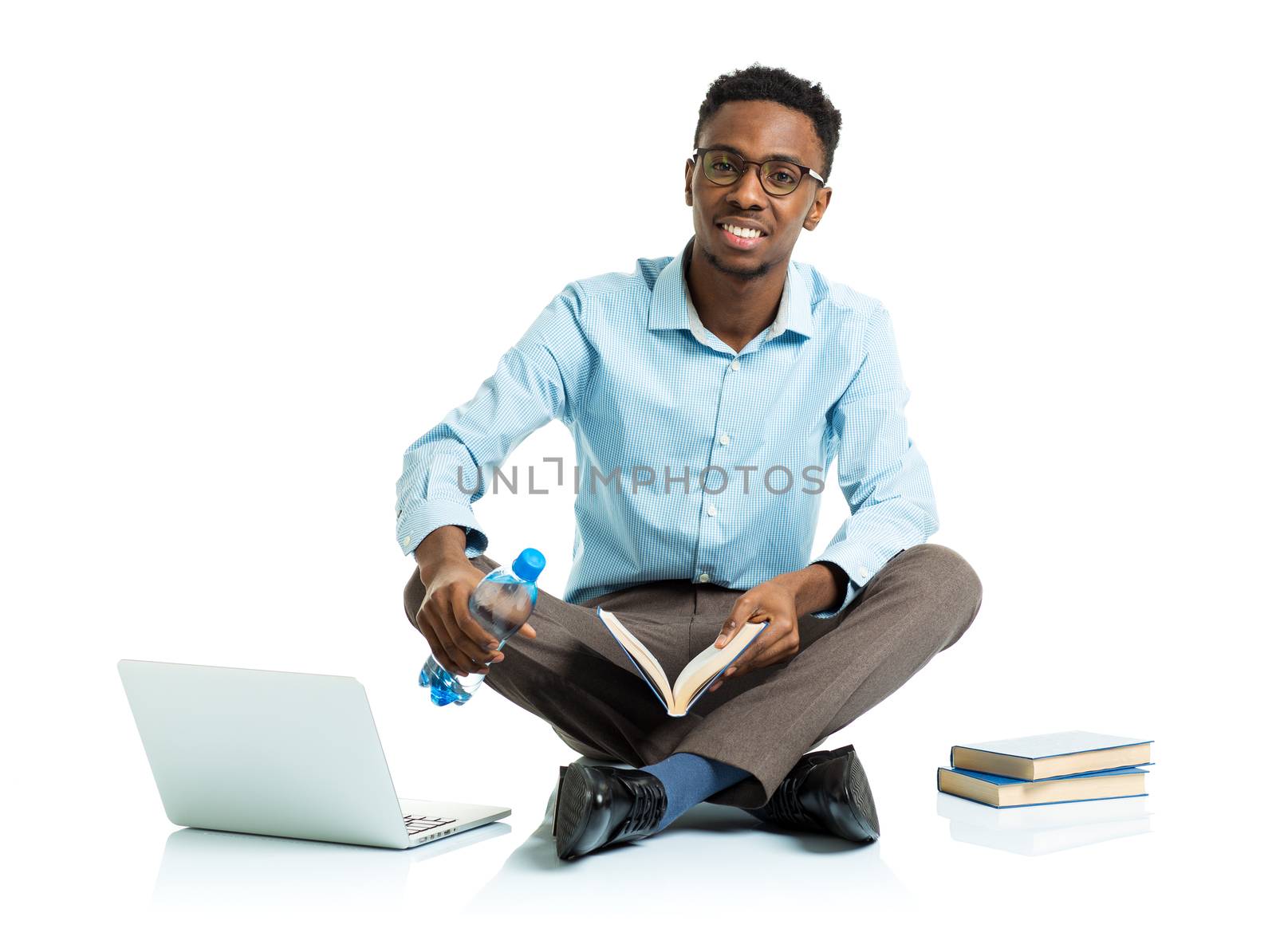 Happy african american college student with laptop, books and bo by vlad_star