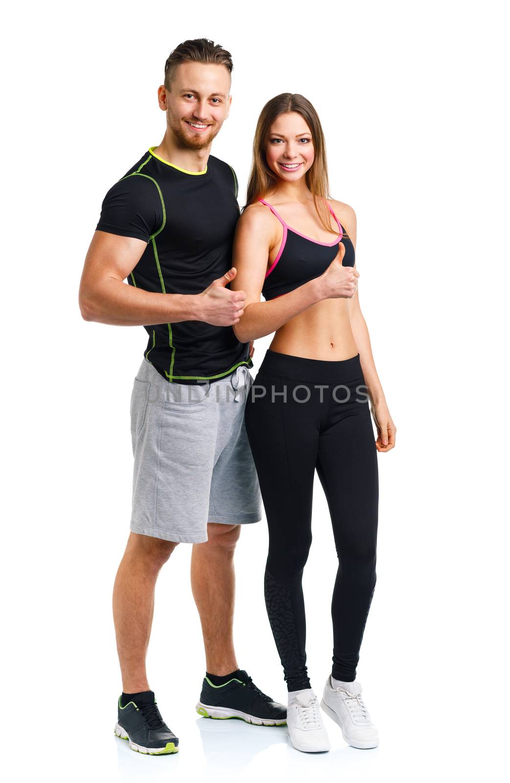 Sport man and woman after fitness exercise with a finger up on t by vlad_star