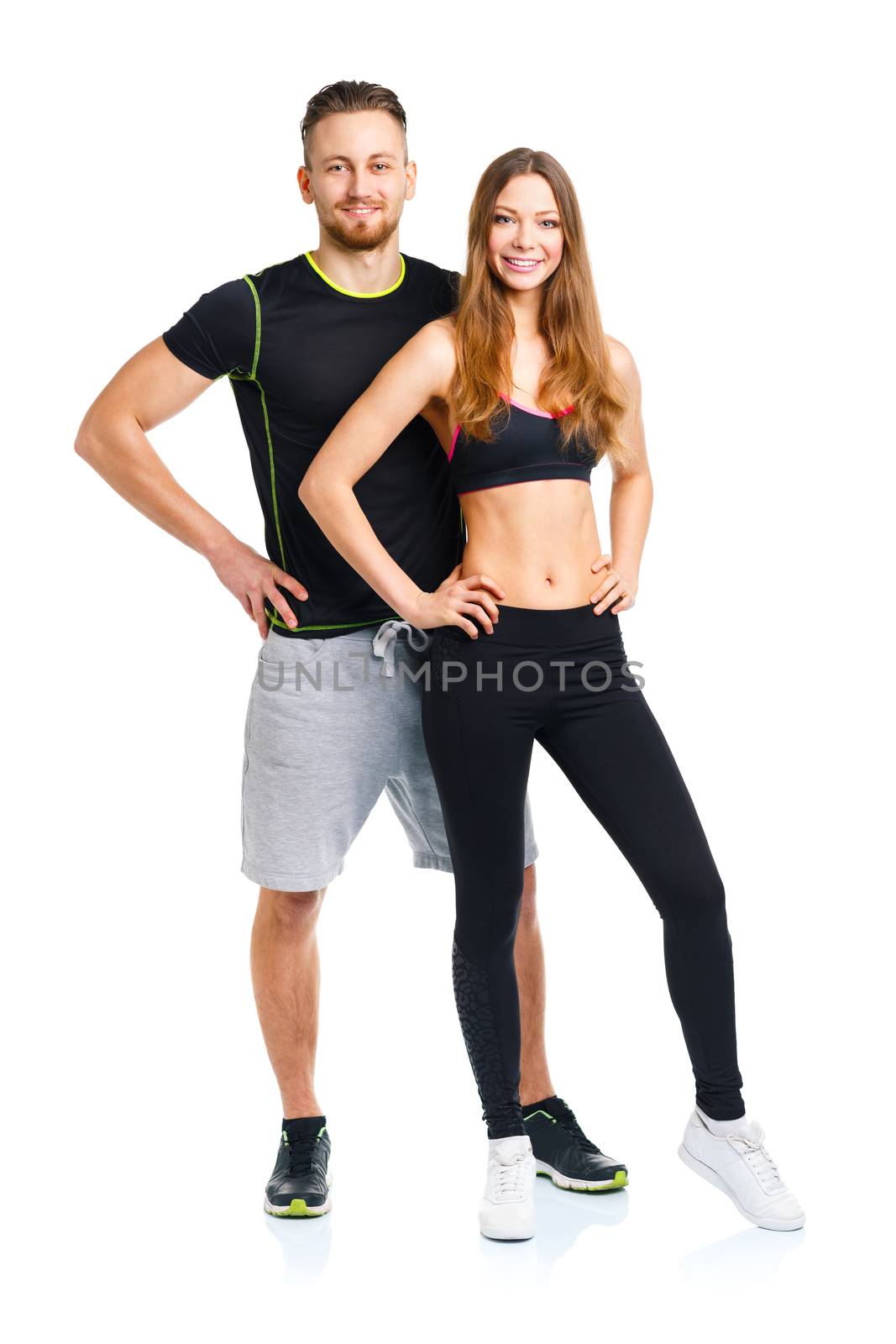 Sport couple - man and woman after fitness exercise on the white background