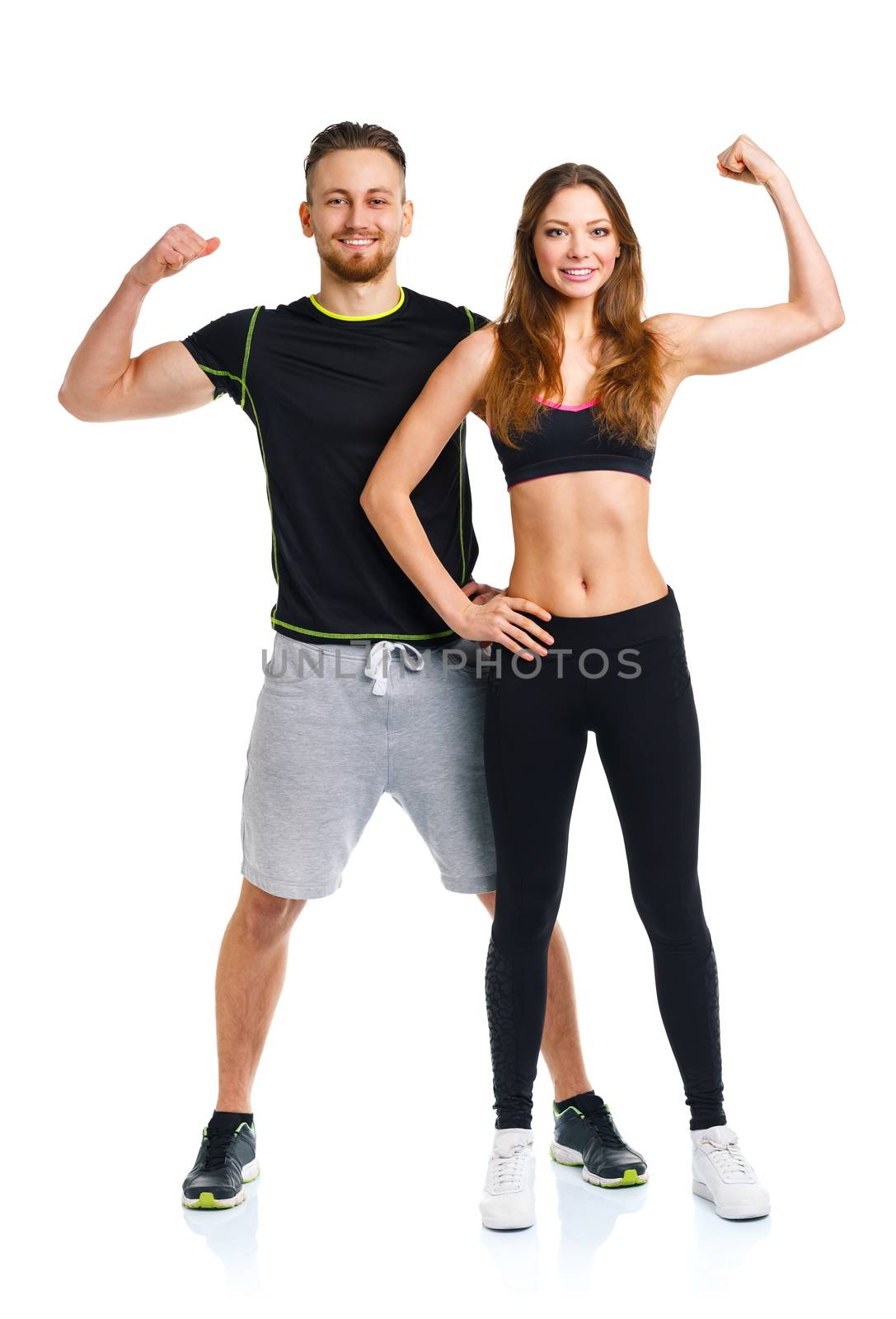 Athletic couple - man and woman after fitness exercise on the wh by vlad_star