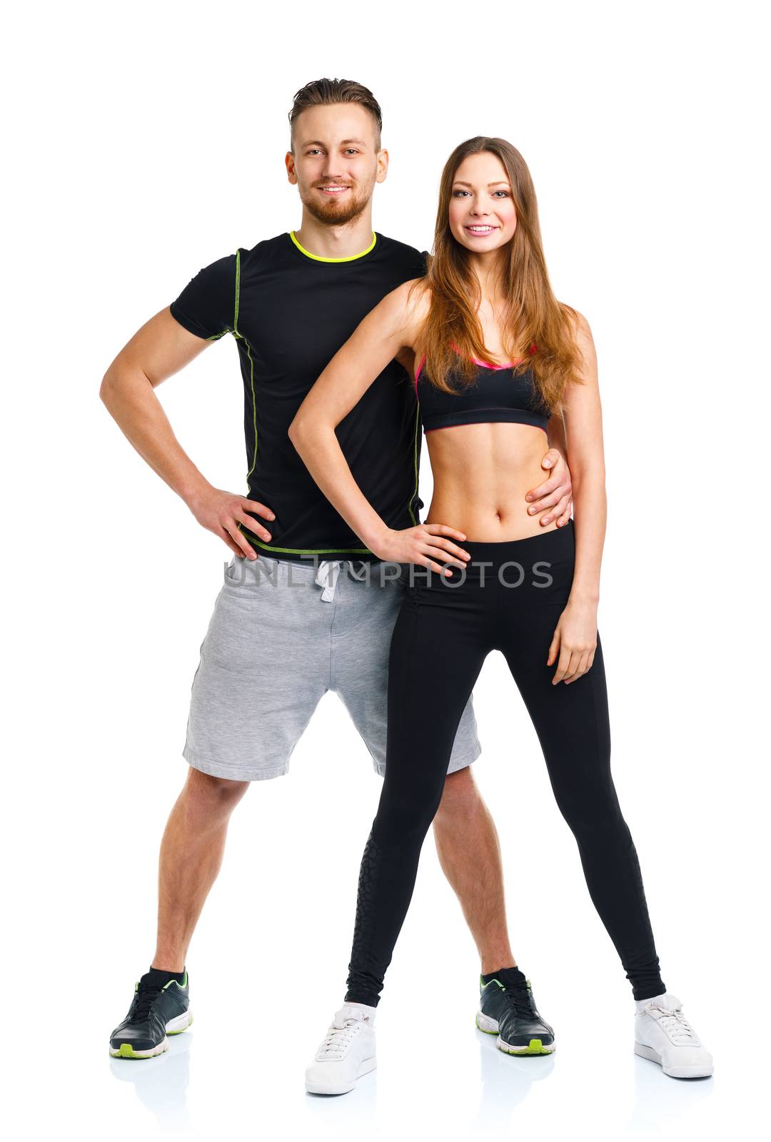 Athletic couple - man and woman after fitness exercise on the wh by vlad_star