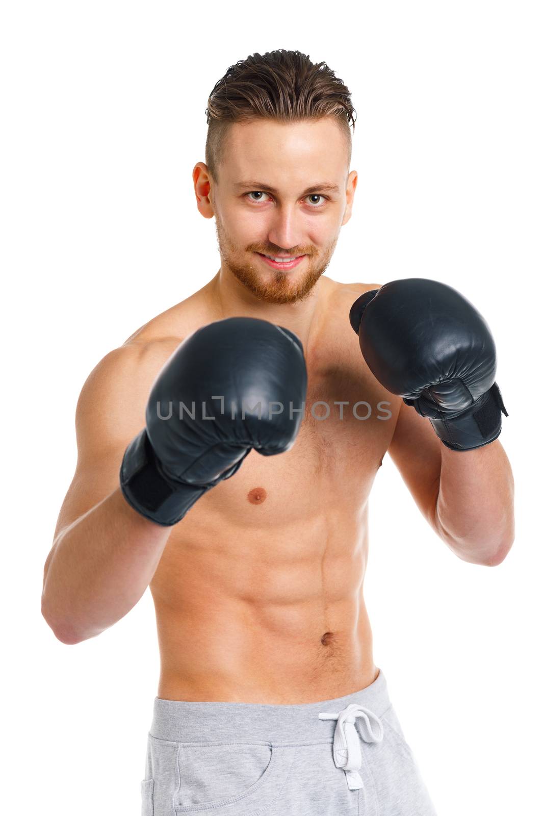 Athletic attractive man wearing boxing gloves on the white by vlad_star