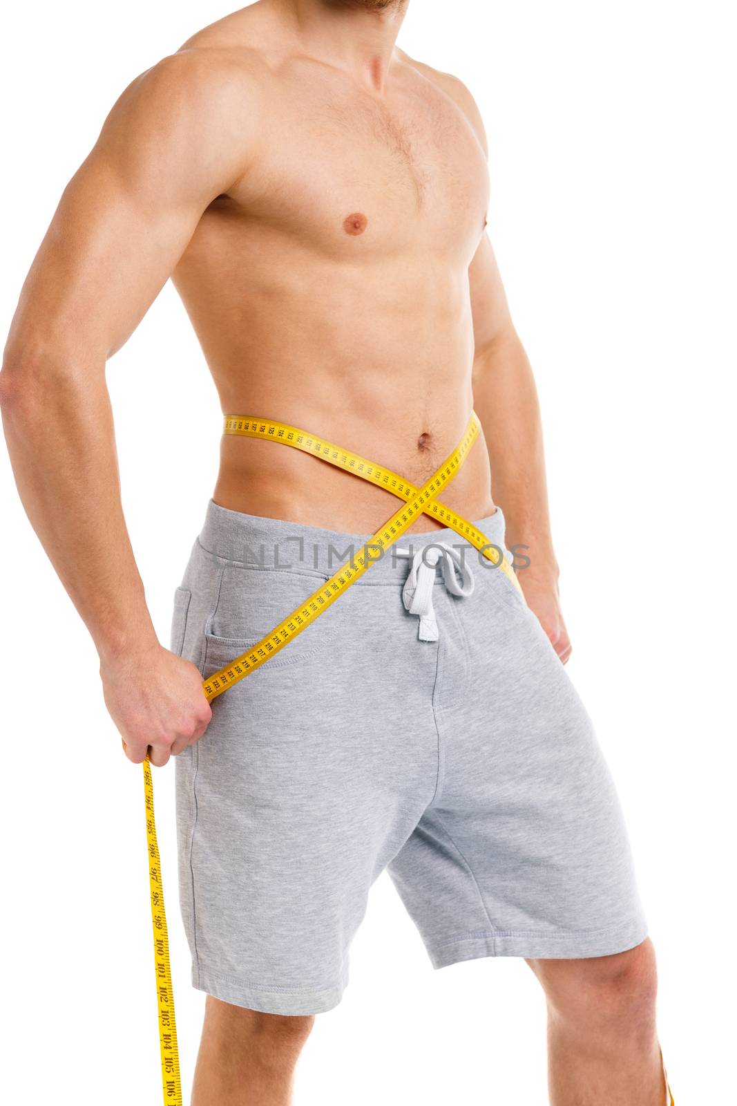 Sport man with measuring tape on the white background