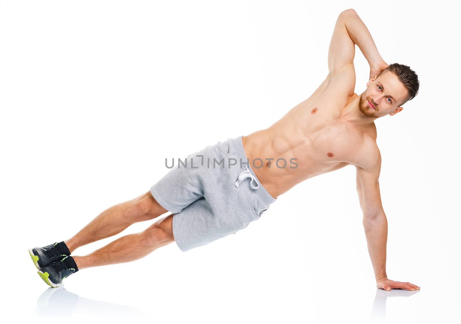 Sport attractive man doing fitness exercises on the white by vlad_star