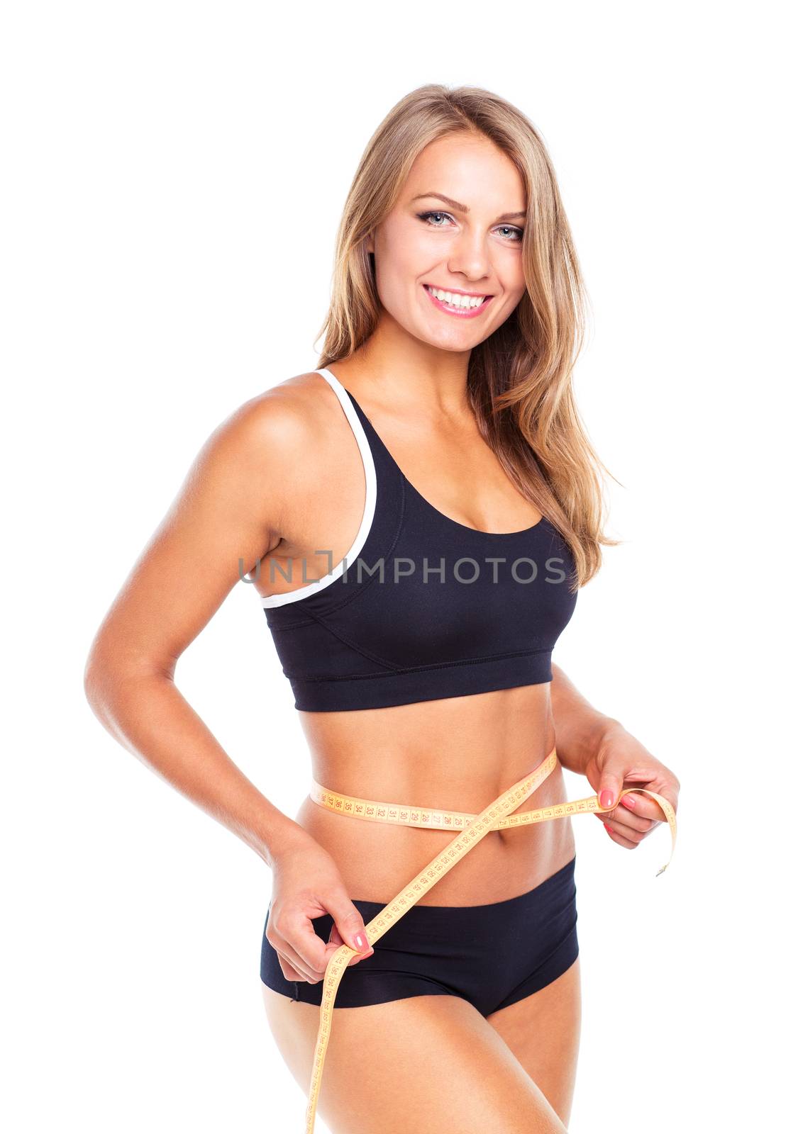 Portrait of attractive caucasian smiling woman with measuring tape isolated on white background