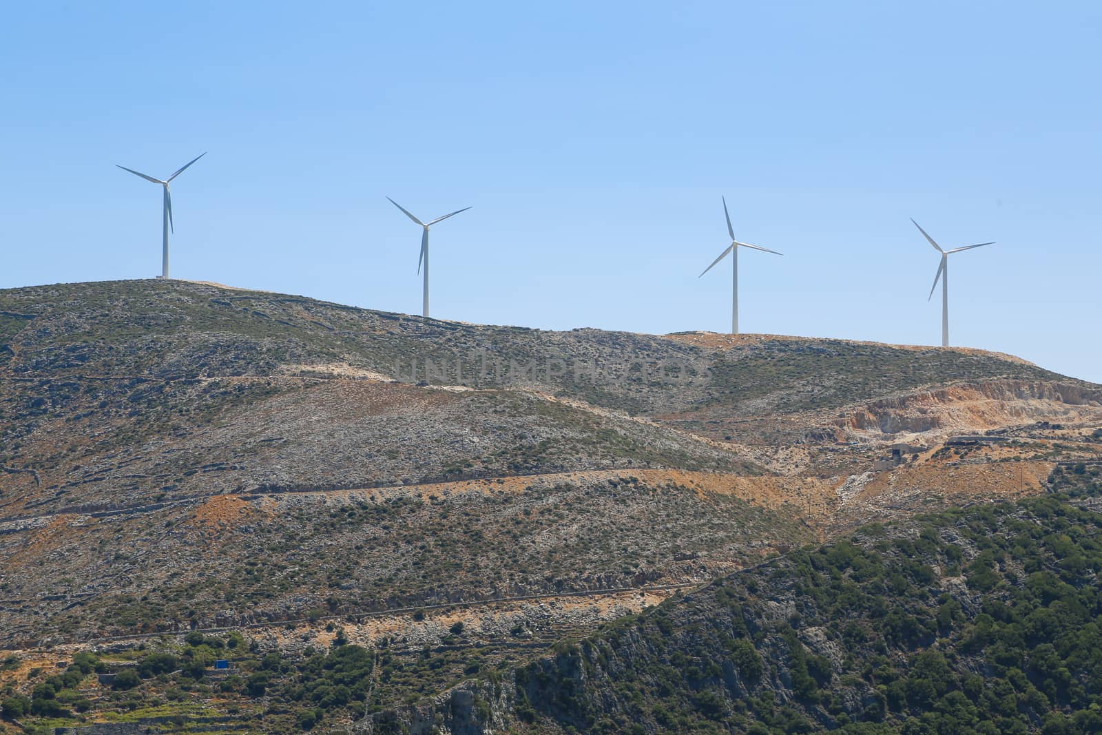 A wind mill farm on top of the mountain