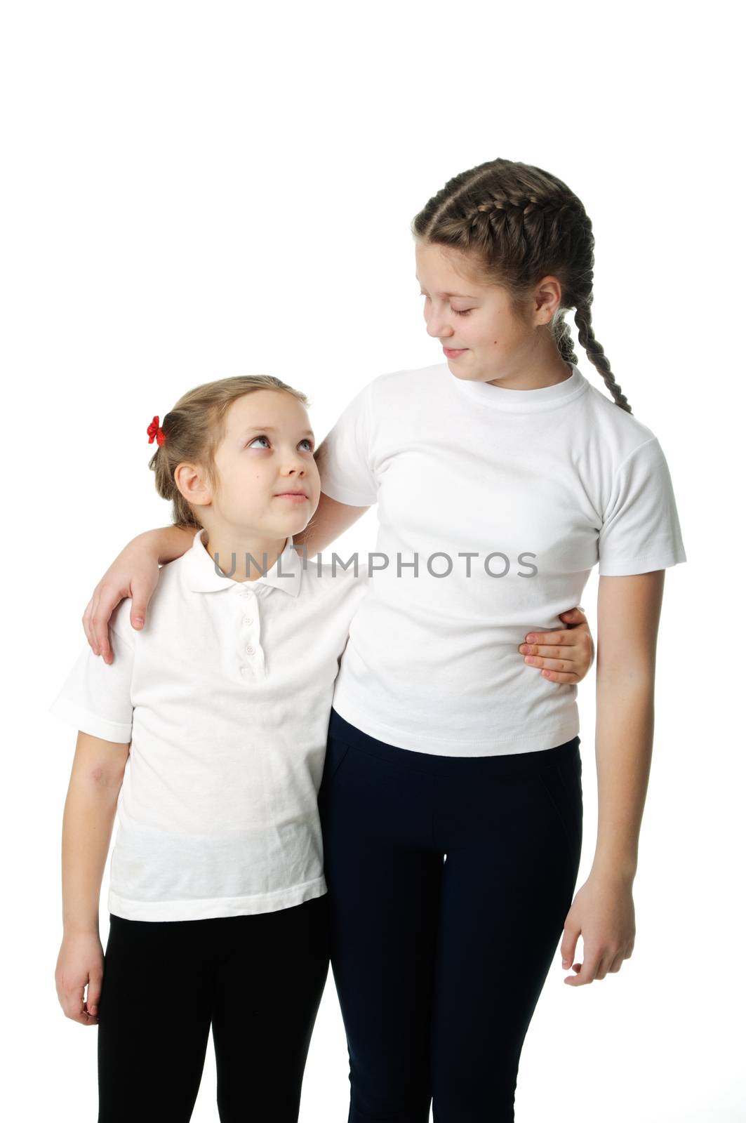 Little girls hugs on white by velkol