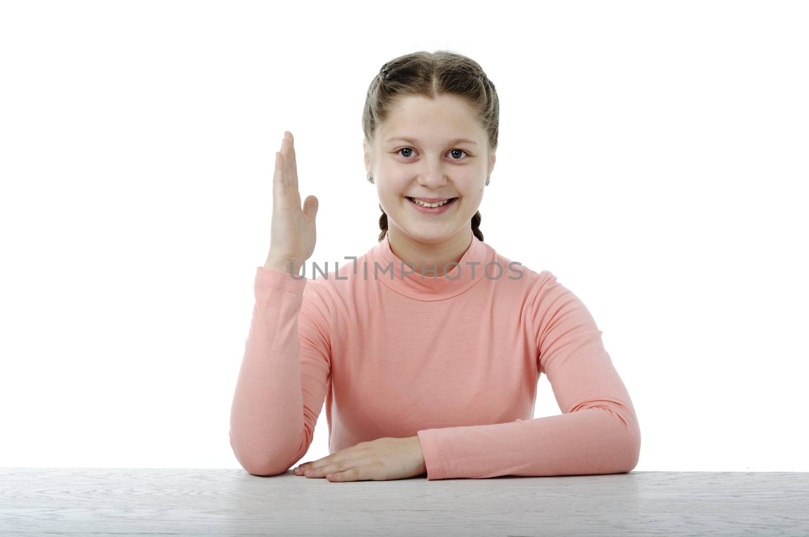 Little girl at the table in school on white by velkol