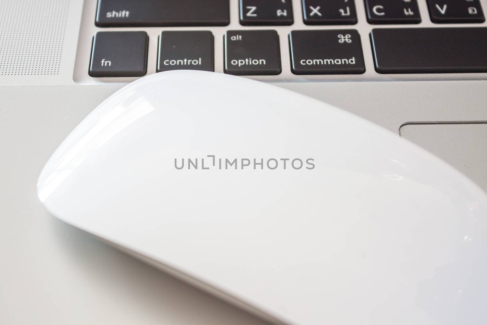 Close up of white labtop with mouse, stock photo