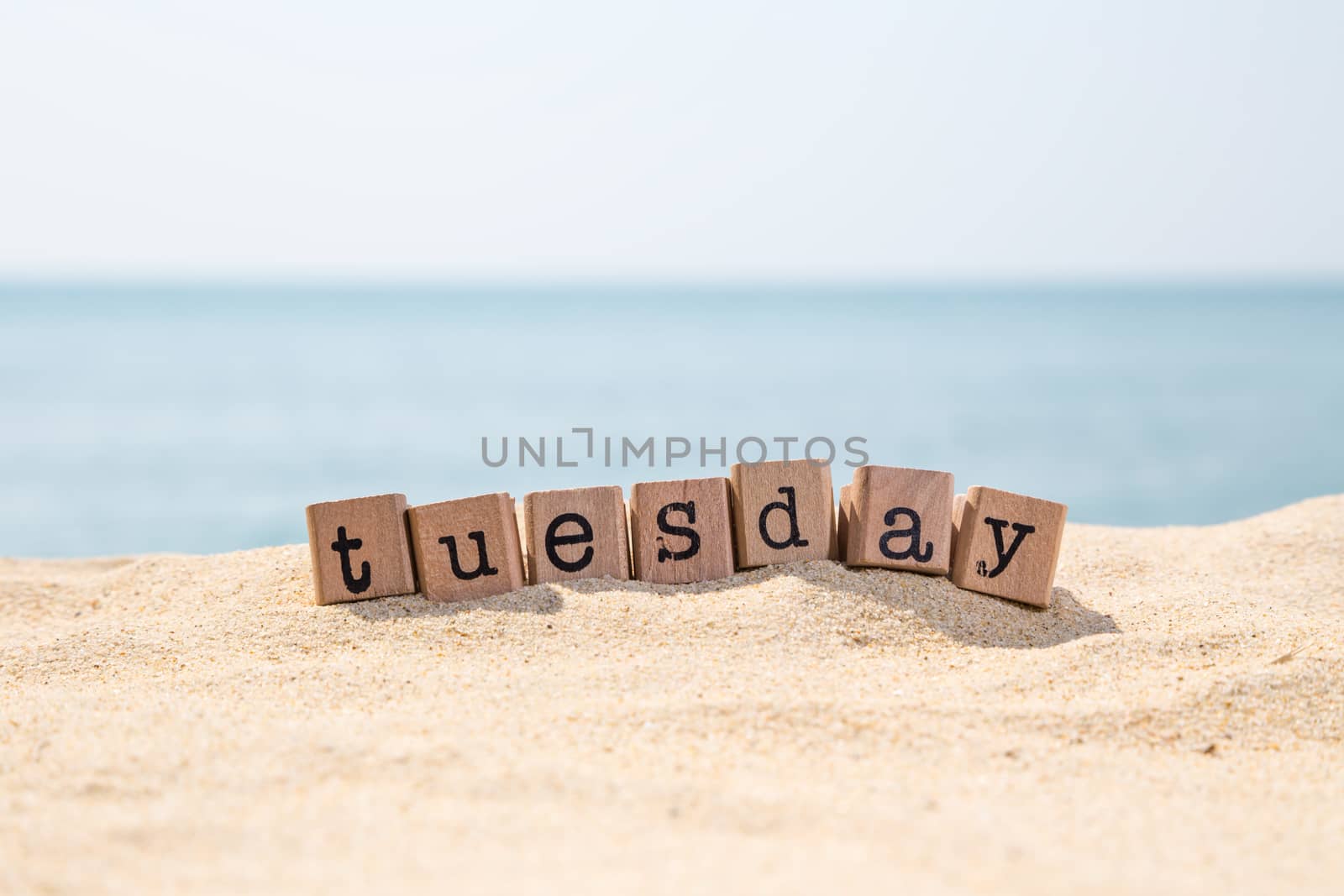 Tuesday word on sea beach by vinnstock