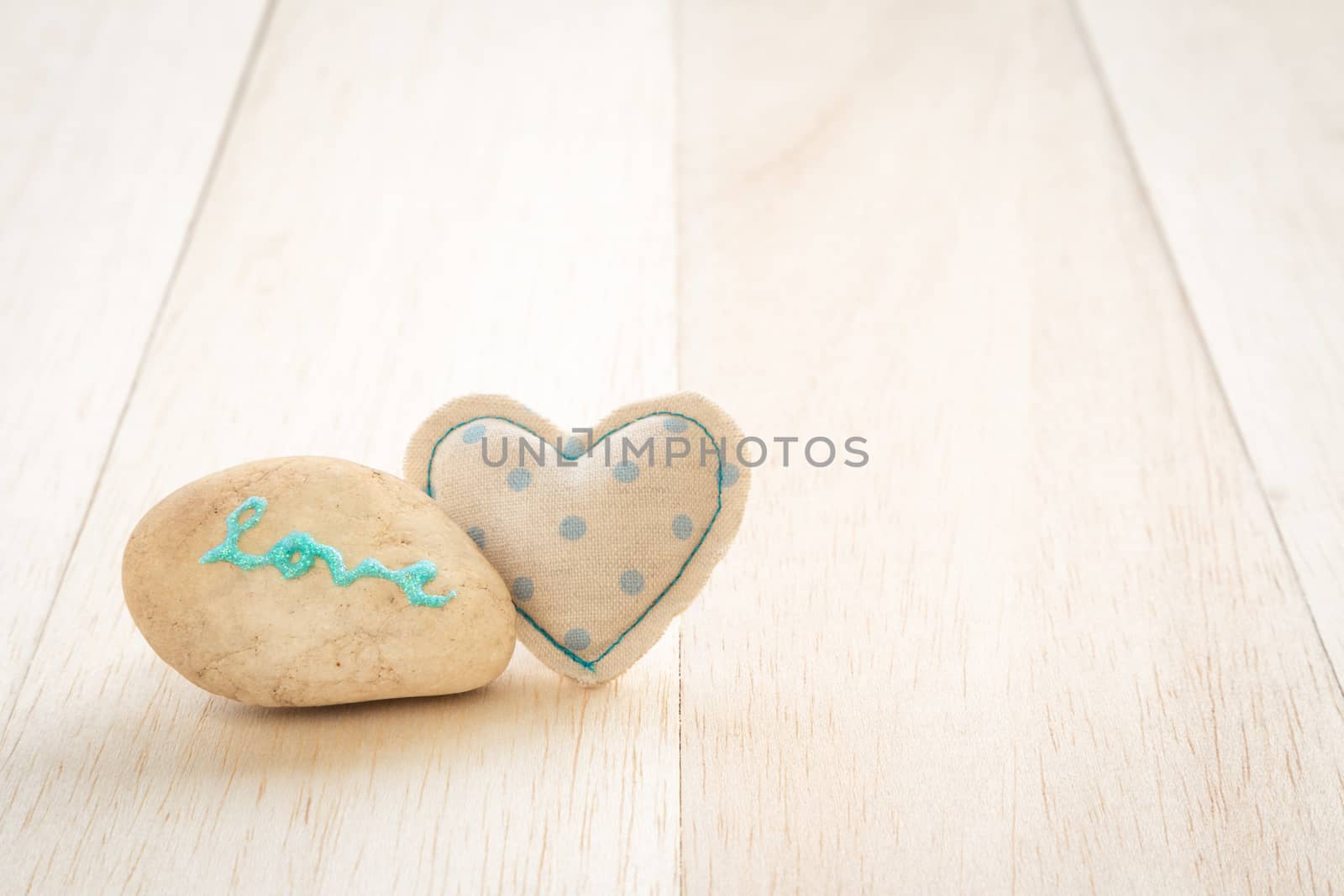 Cute handmade heart and glitter love word on stone by vinnstock