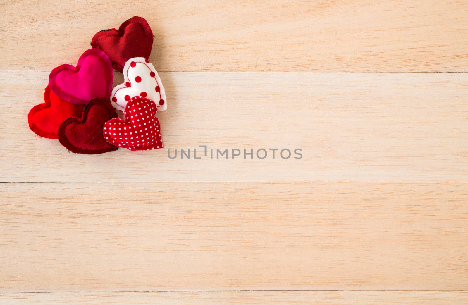 Red valentine hearts symbol on wood background by vinnstock