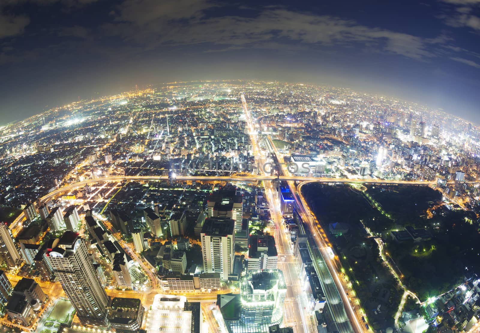 Aerial fisheye view of buildings in Osaka in Japan at night