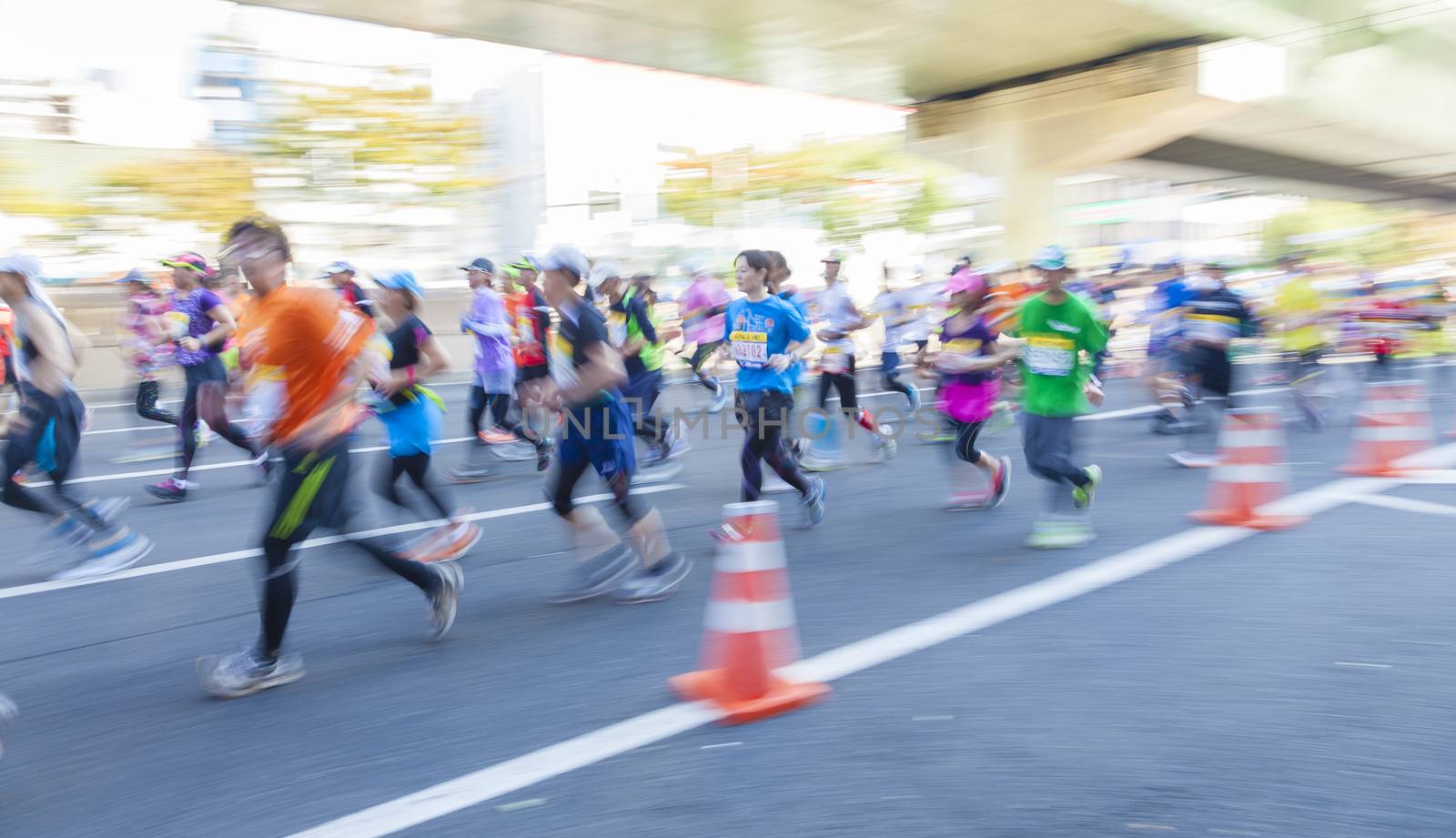 Osaka, Japan - Oct 26: Runners participating in the 2014 Osaka Marathon in Osaka, Japan on Oct 26, 2014.  Some runners were wearing fancy dress