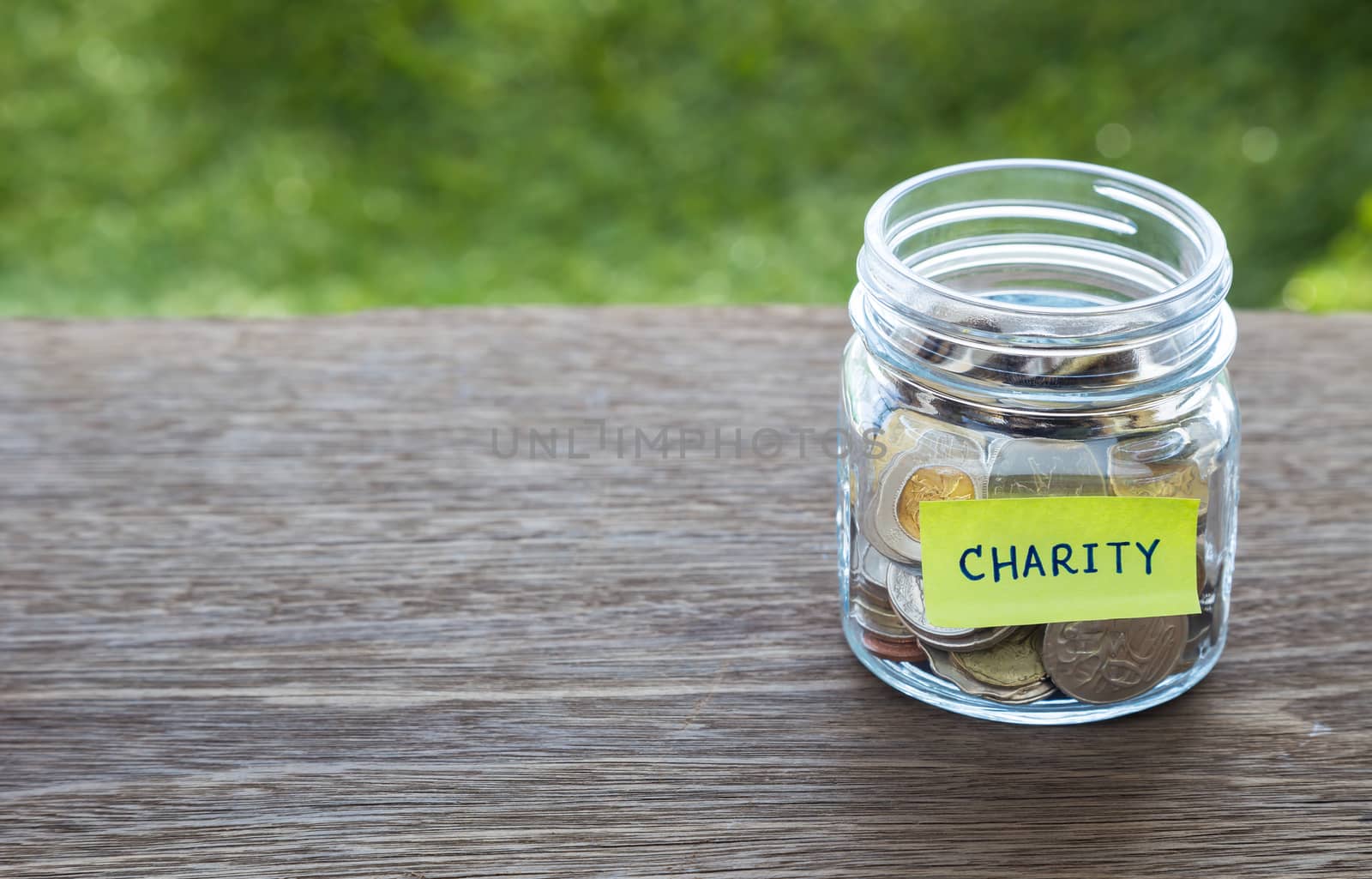 Charity donation money glass jar by vinnstock