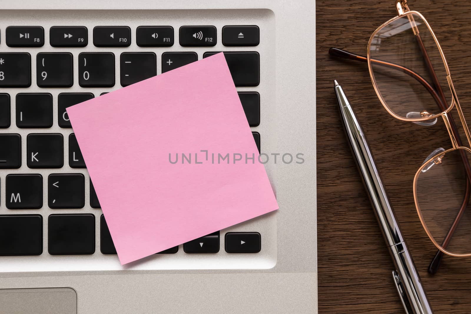Pink blank paper on laptop for note by vinnstock