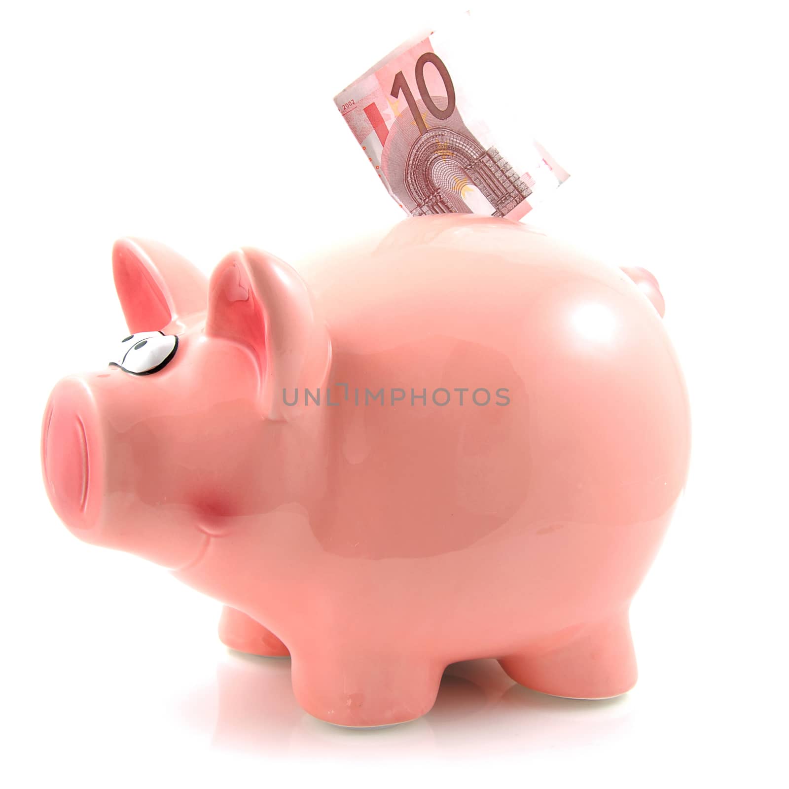 Piggy bank with euro money over white background