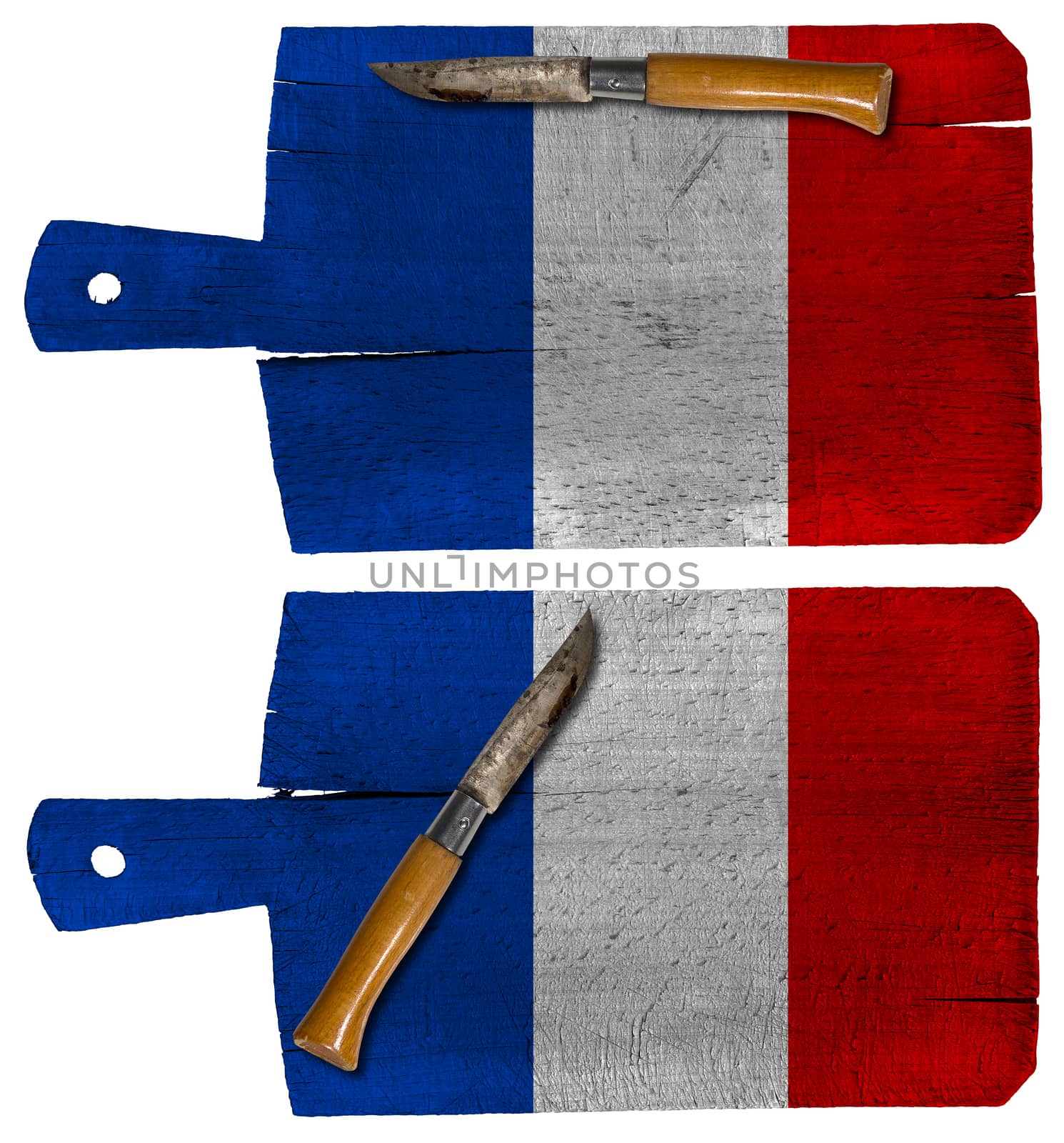Old cutting boards with French flag and pen knife isolated on white background