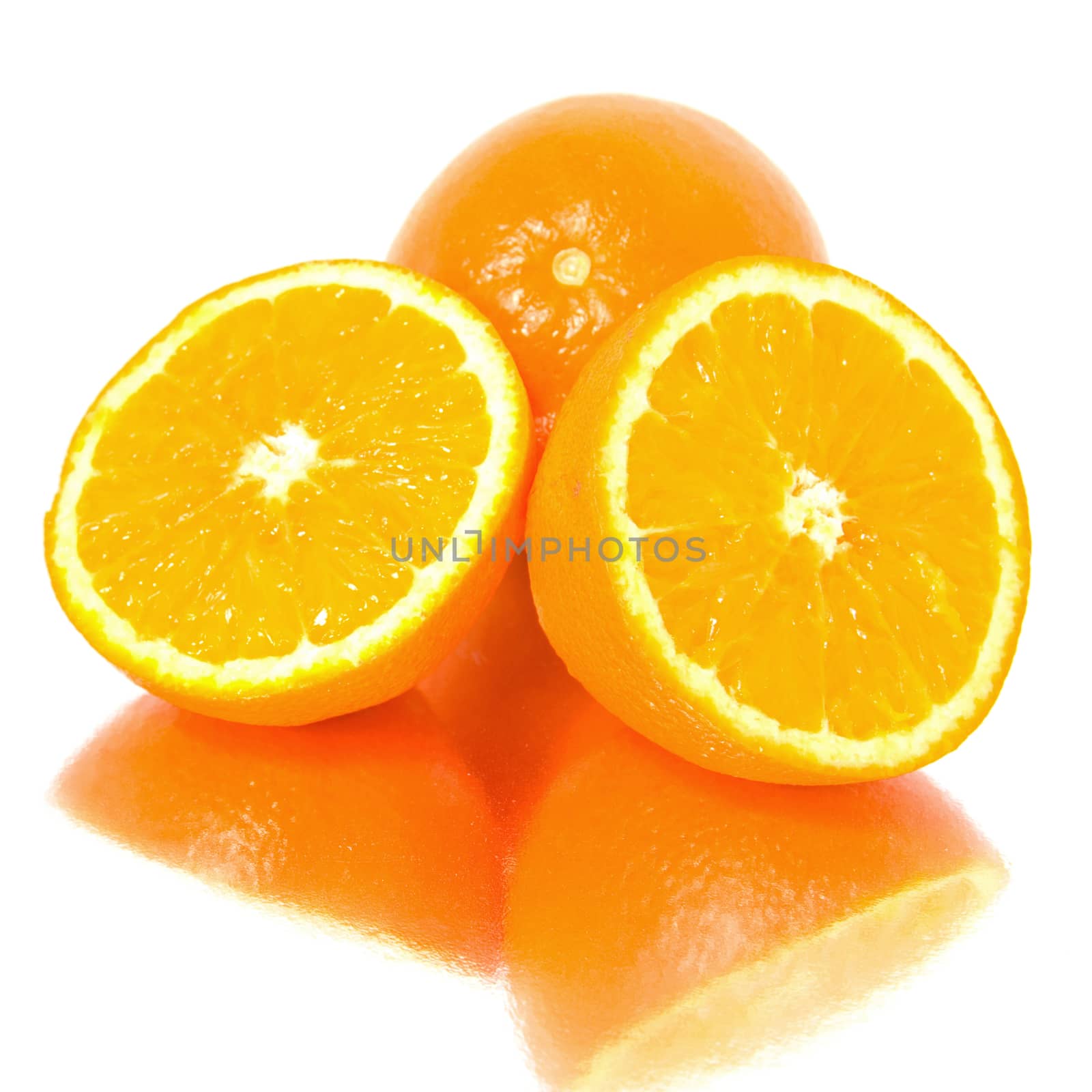 Oranges reflected in a mirror, isolated on white background