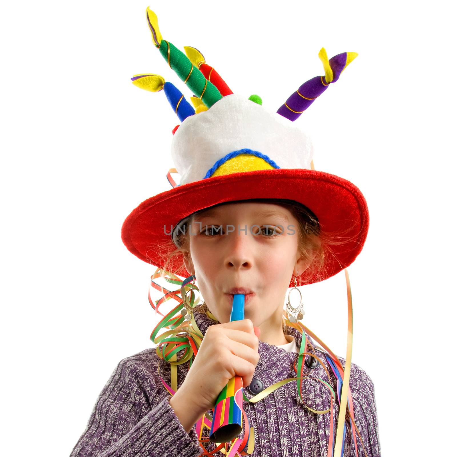Birthday girl with streamers and horn over white background