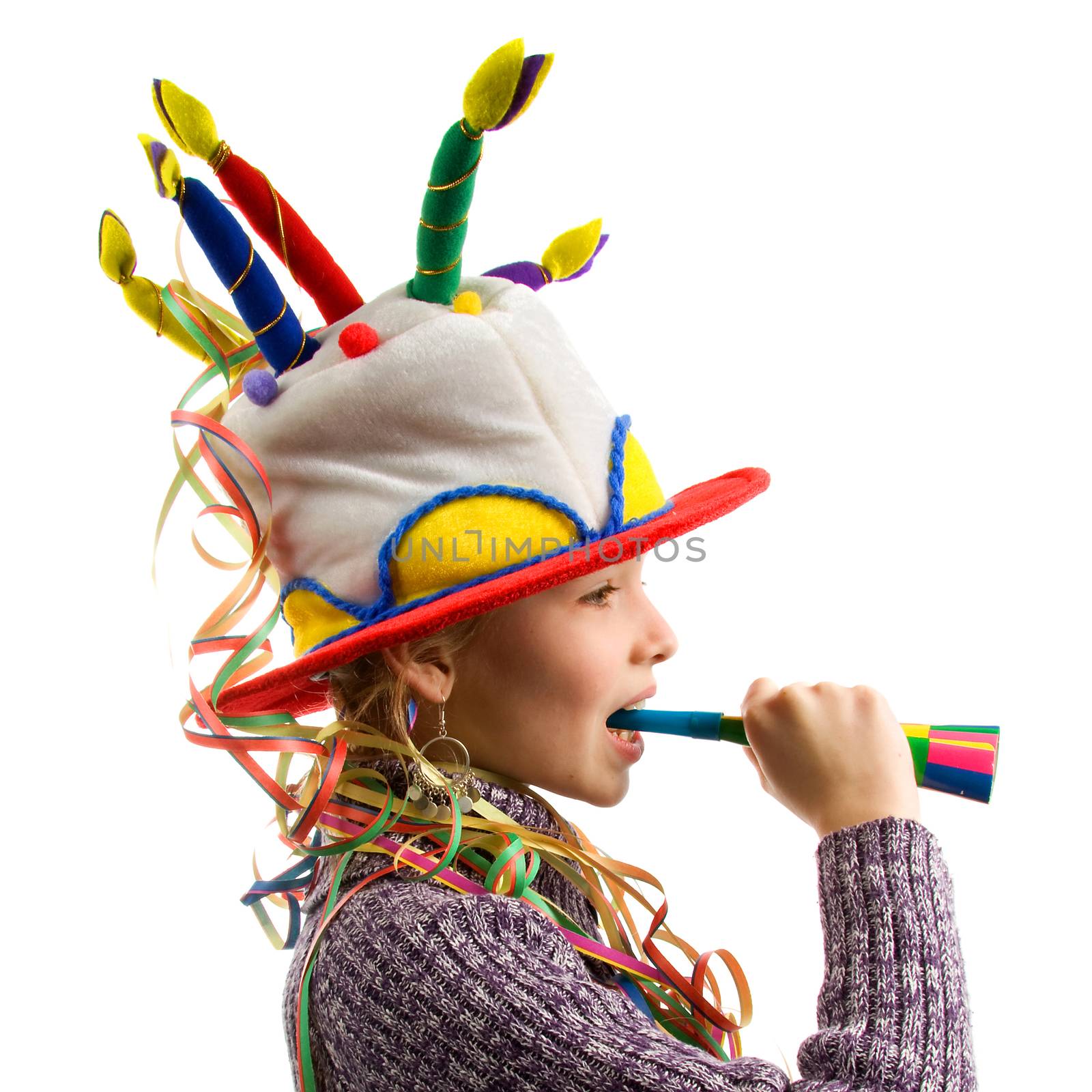 Birthday girl with streamers and horn over white background