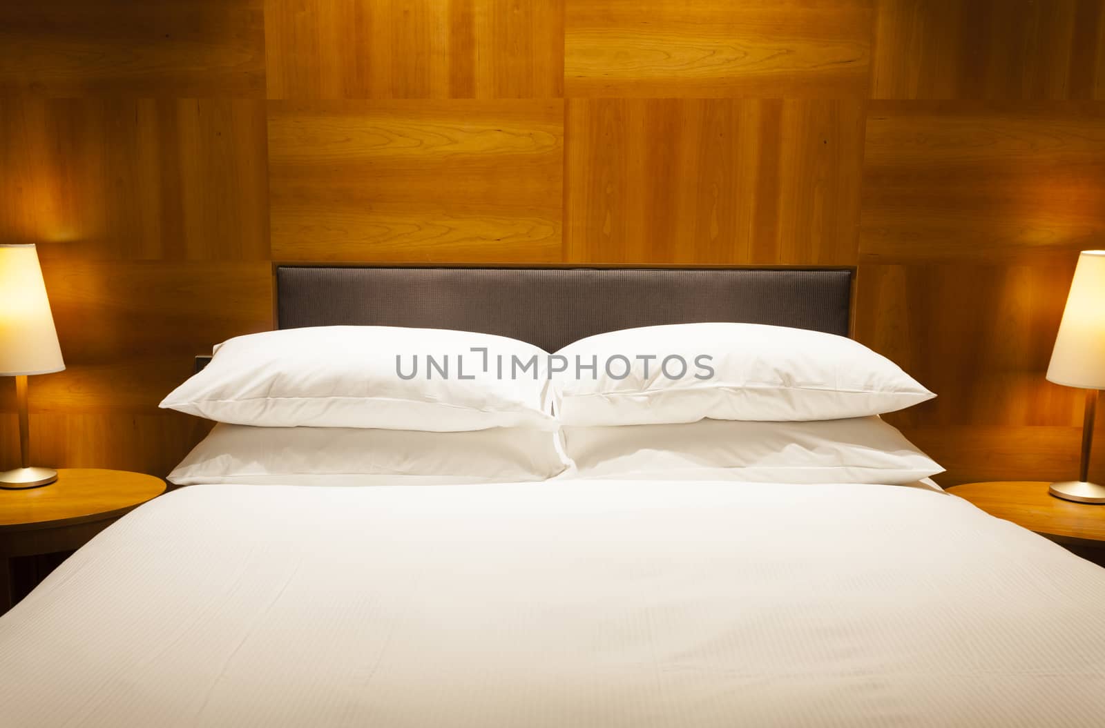 View of a luxurious hotel room with double bed