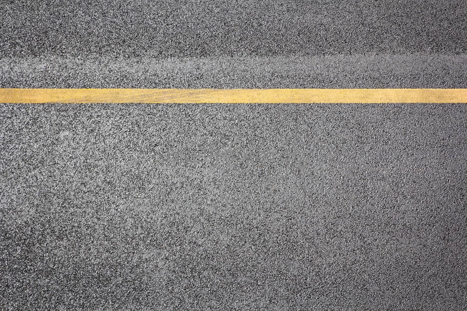 top view road highway surface with single yellow line asphalt backdrop