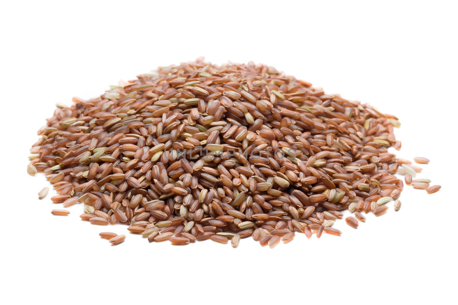 pile of brown rice isolated on white background