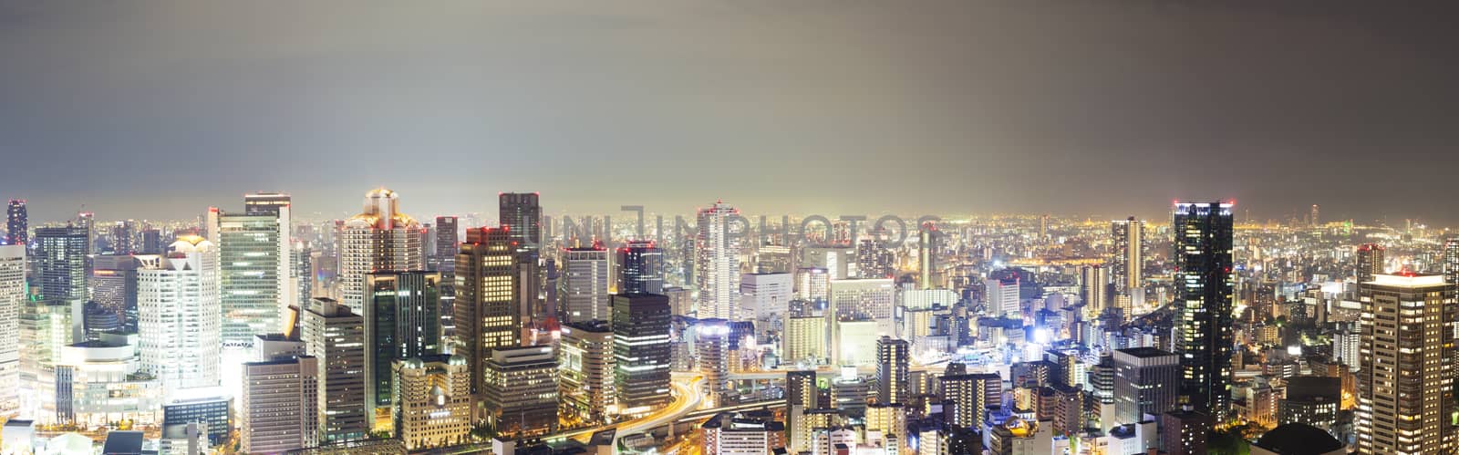 Panoramic view of skyline at night in Osaka, Japan