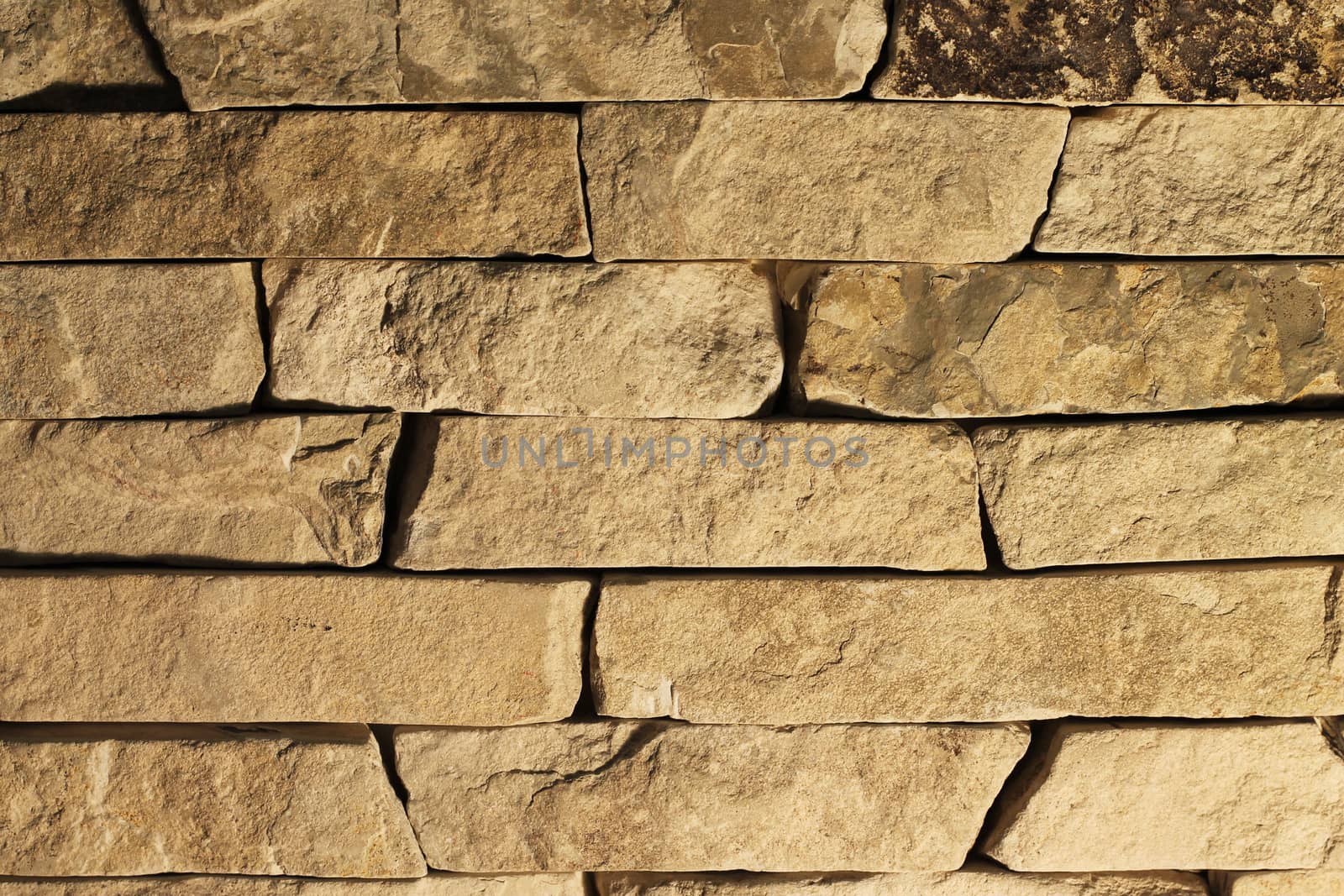 Decorative brickwork of natural, medium size gray stones 