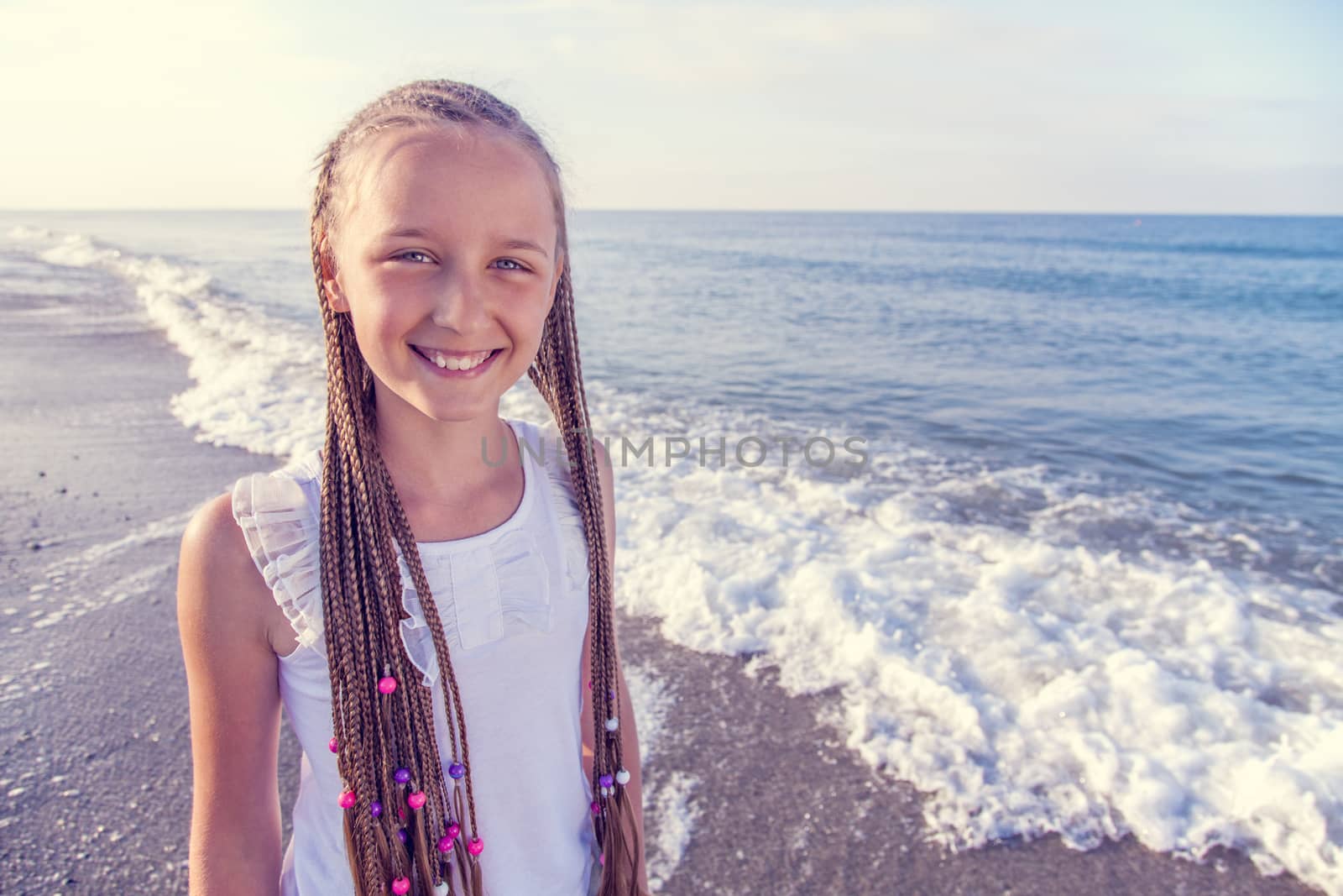Portrait of a girl with long braids on her head by anelina