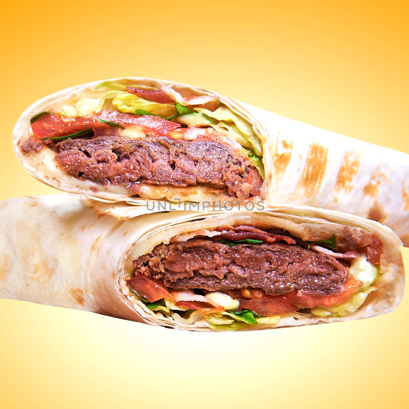 Pita - grilled meat and vegetables isolated on yellow background