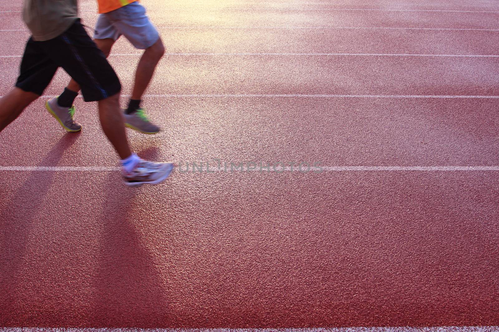 Running athlete at the stadium by foto76