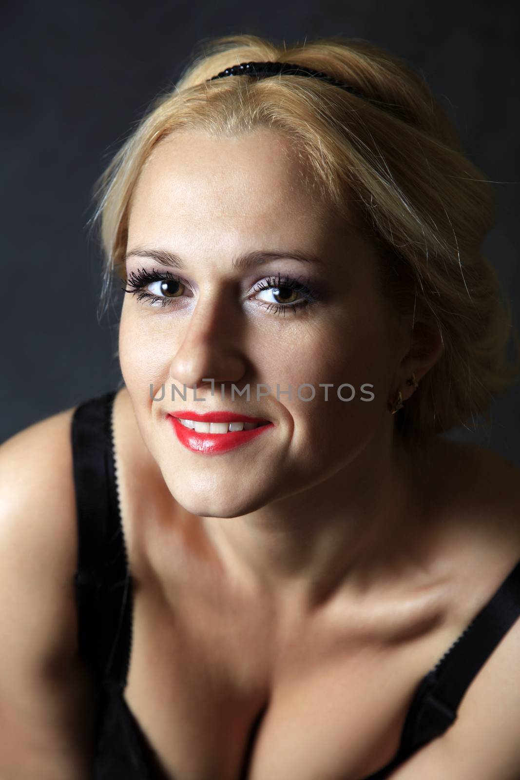 Beautiful young blond woman portrait in studio