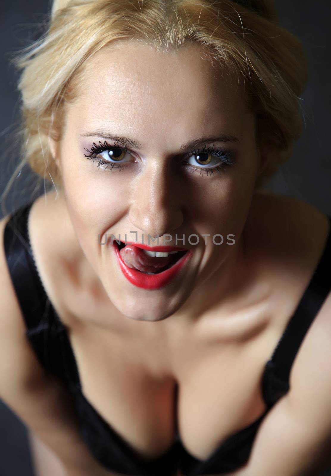 Beautiful young blond woman portrait in studio